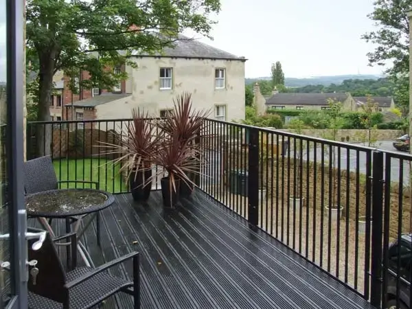 Decked area at Clouds Hill Holiday Home with Gym and Pool