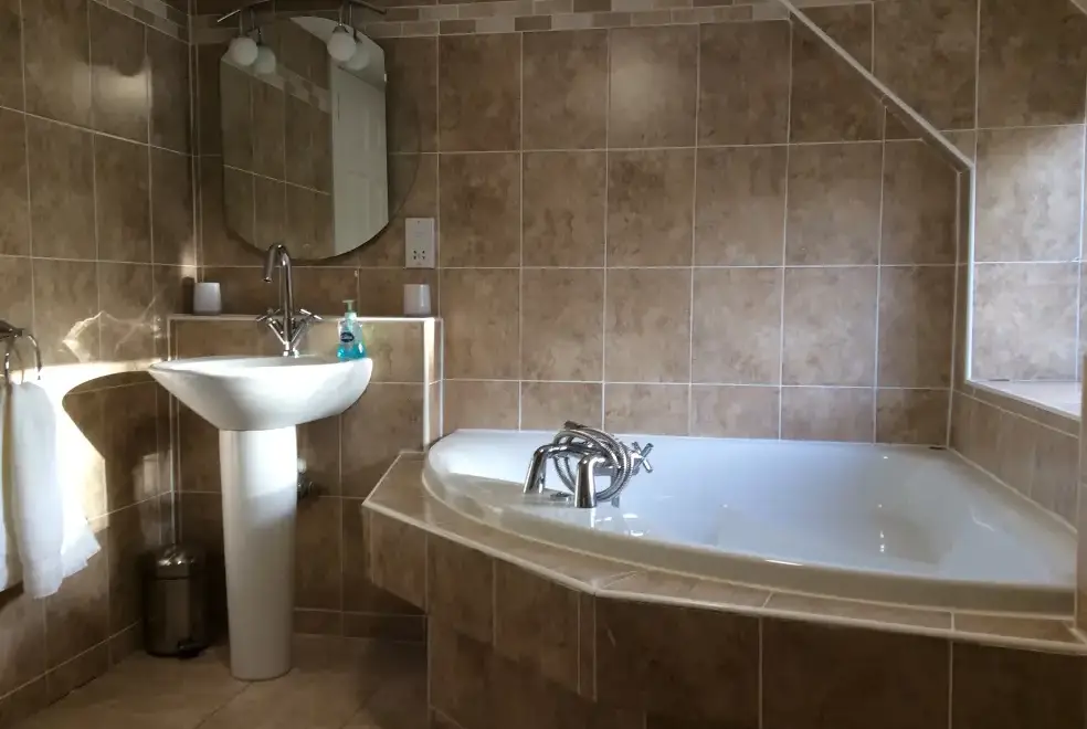 Luxurious family bathroom at Craig Cottage