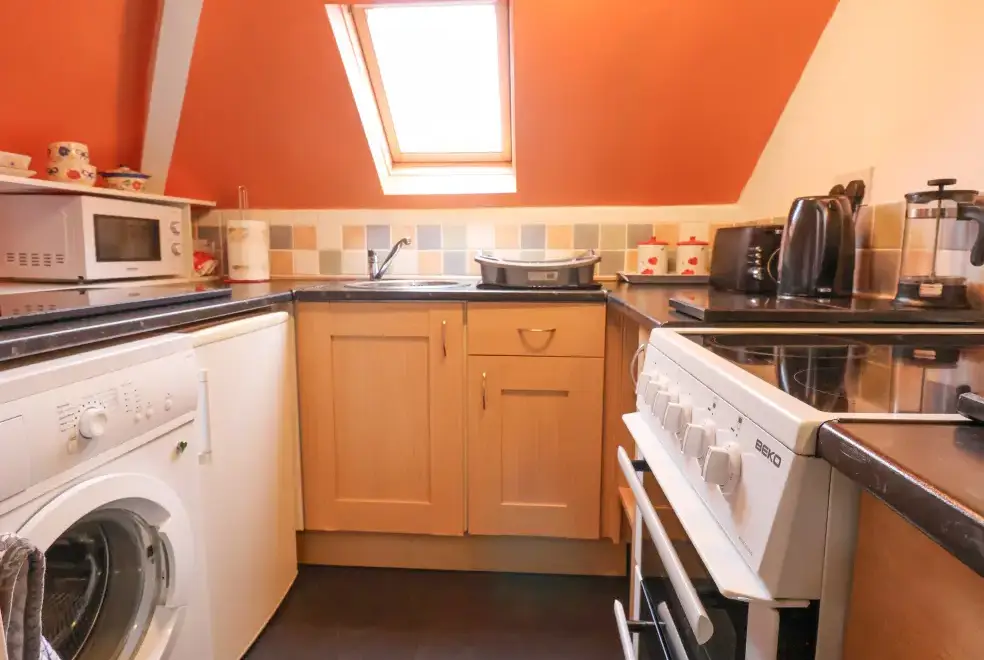 Well equipped kitchen at Dragon's Den