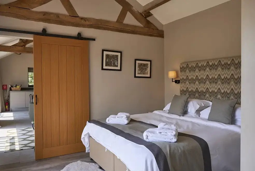 Bedroom at Field Barn sleeps 2, with a private Steam Room and AirCon!