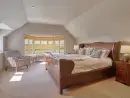 Luxurious bedroom at Four Ashes (Stunning Water Views) - thumbnail photo