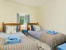 Twin bedroom at Gatehouse West, Colmer Estate - thumbnail photo