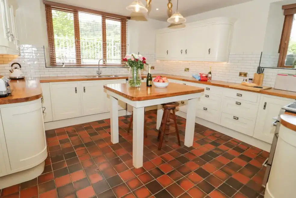 Farmhouse style kitchen at Gwern Borter Manor