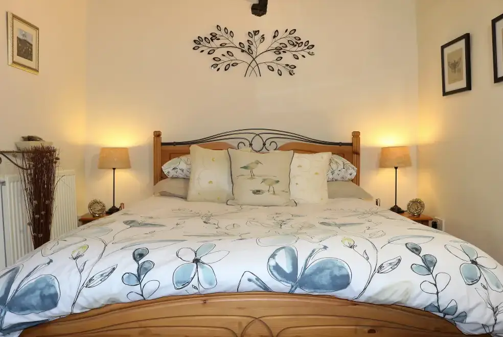 Bedroom at Honeysuckle, dog friendly couples' cottage in South Devon