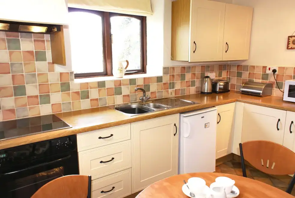 Kitchen/diner at Honeysuckle, dog friendly couples' cottage in South Devon