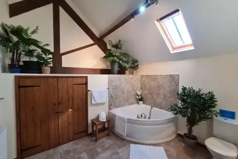Family bathroom at James's Parlour with exclusive use of shared Indoor Swimming Pool, Sports Court & Play Area, Shropshire