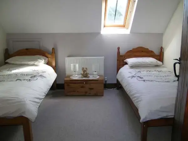 Bedroom at Kitty's Loft Self-catering Cottage, Godshill, South Coast 