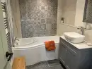Bathroom with shower over bath at Lingcombe Barn in Dartmoor - thumbnail photo