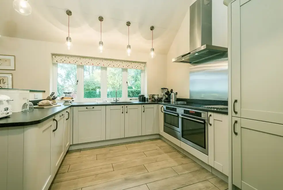 Well equipped kitchen at Mendham Mill - a fabulous holiday home over a river