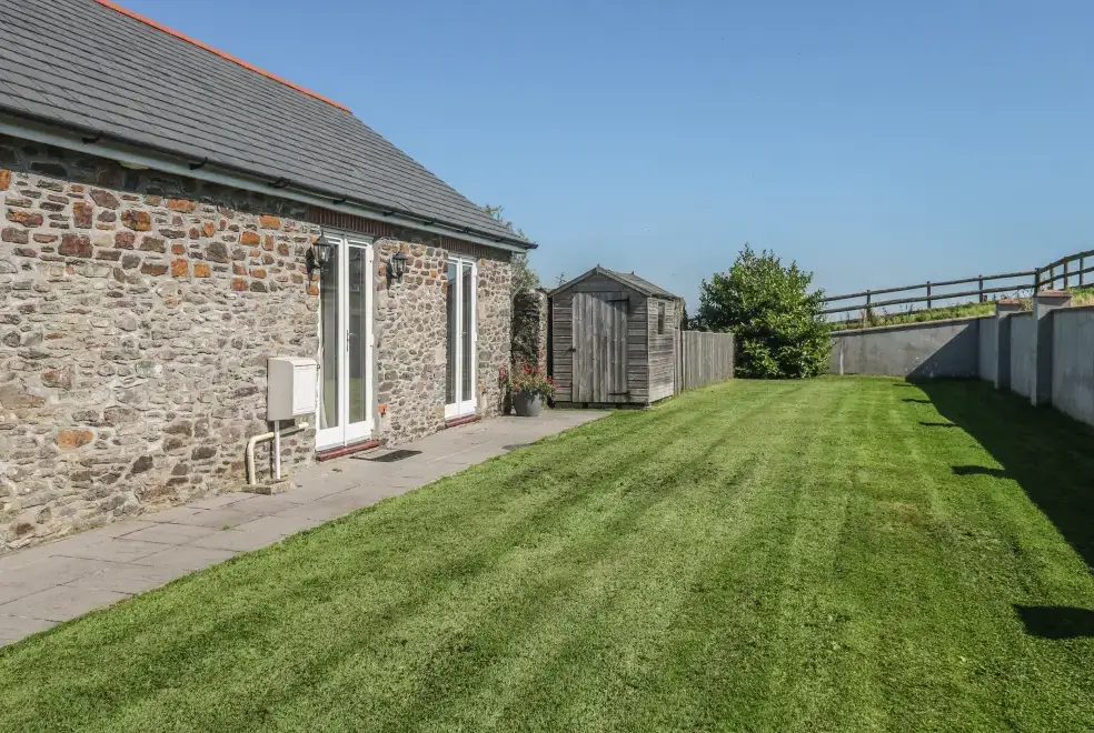 Enclosed garden at Middle Barn Dogs-welcome Cottage, South West England