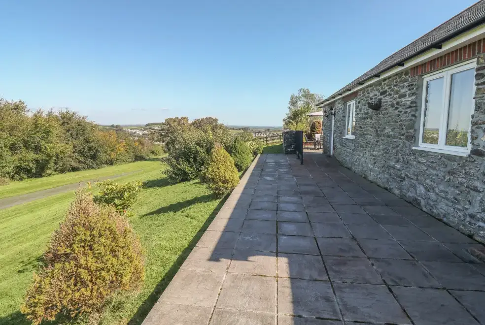 Patio area at Middle Barn Dogs-welcome Cottage, South West England