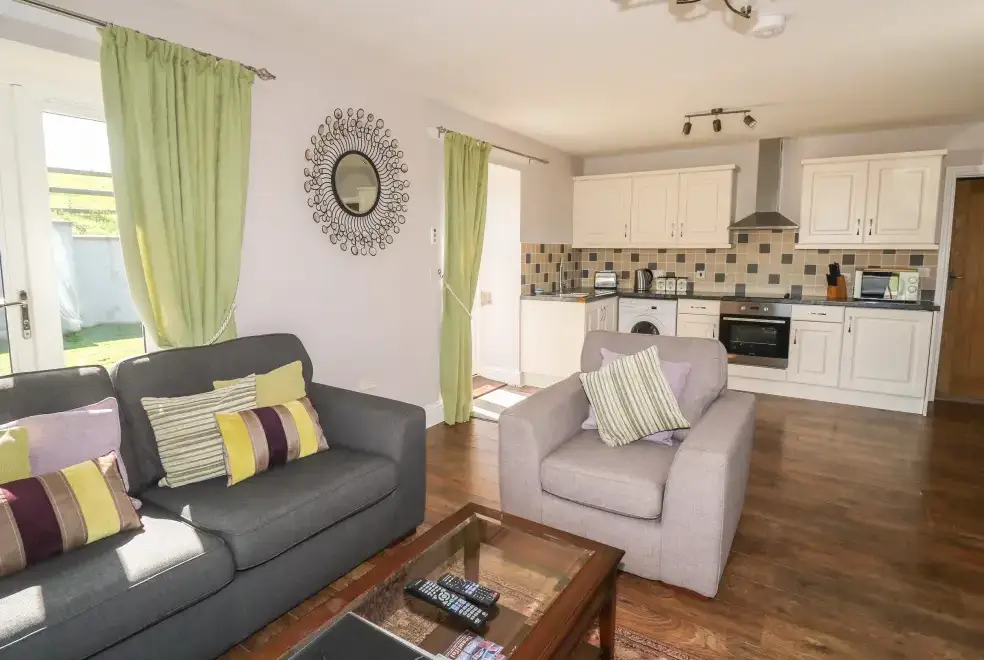 Open plan living area at Middle Barn Dogs-welcome Cottage, South West England