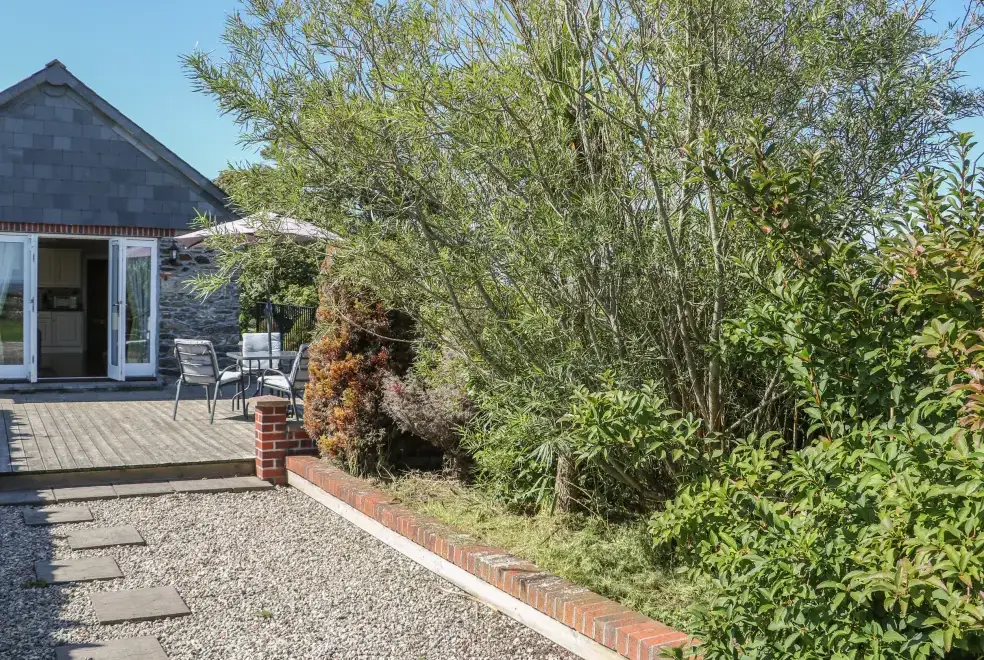 Patio area at Middle Barn Dogs-welcome Cottage, South West England