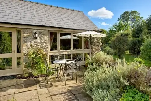 Set in beautiful gardens of listed mill