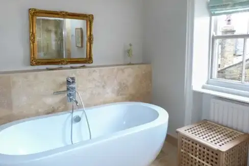 Family bathroom at Old Forge Romantic Cottage, Bronte Country, West Yorkshire
