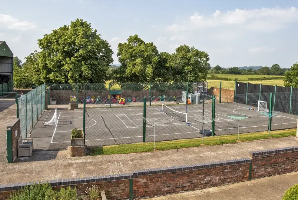 Outdoor games area at Oliver's Mill with shared Indoor Pool, Sports Court & Play Area