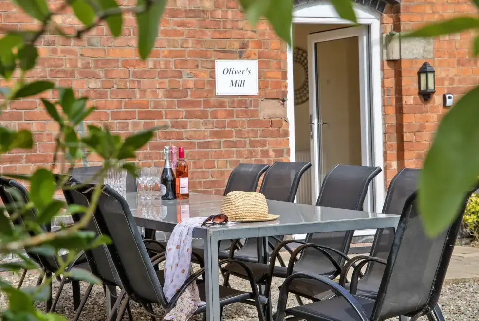 Patio area at Oliver's Mill with shared Indoor Pool, Sports Court & Play Area