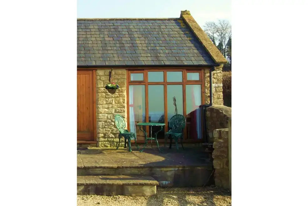 Patio area at Owl Cottage at Coombe Barn Cottages