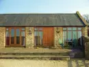 Owl Cottage at Coombe Barn Cottages, from the outside - thumbnail photo