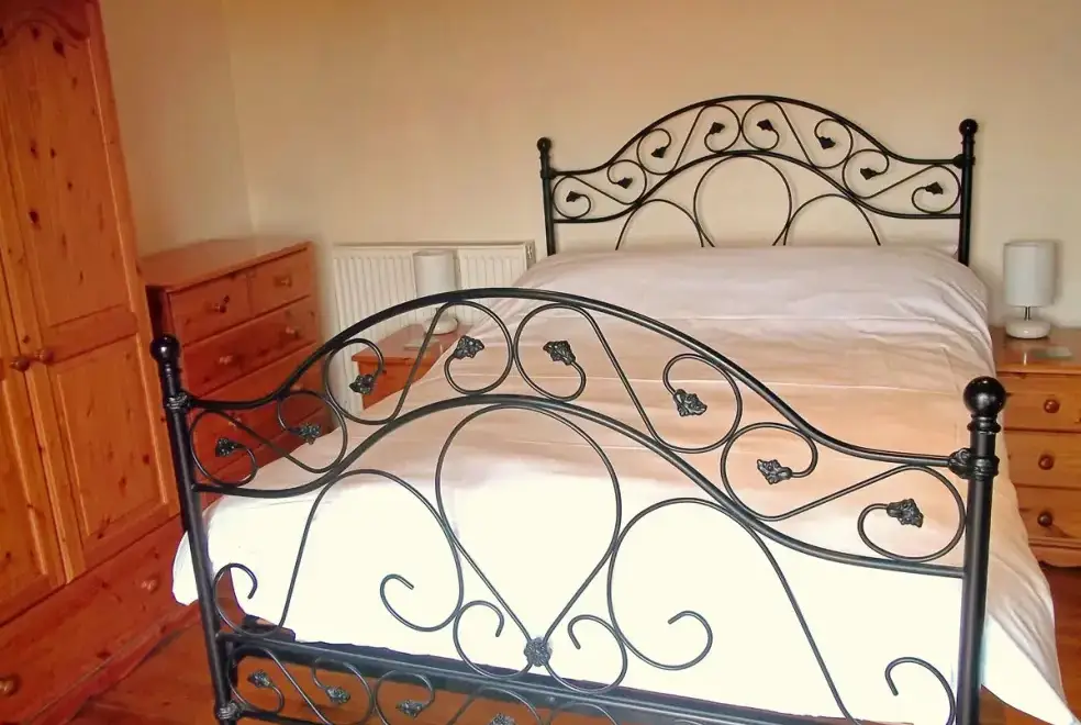 Bedroom at Owl Cottage at Coombe Barn Cottages