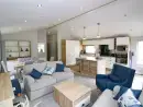 Open plan living area at Pinehurst Lodge - thumbnail photo