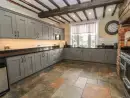 Farmhouse style kitchen at Rhandregynwen Hall - thumbnail photo