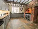 Farmhouse style kitchen at Rhandregynwen Hall - thumbnail photo