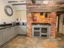 Farmhouse style kitchen at Rhandregynwen Hall - thumbnail photo