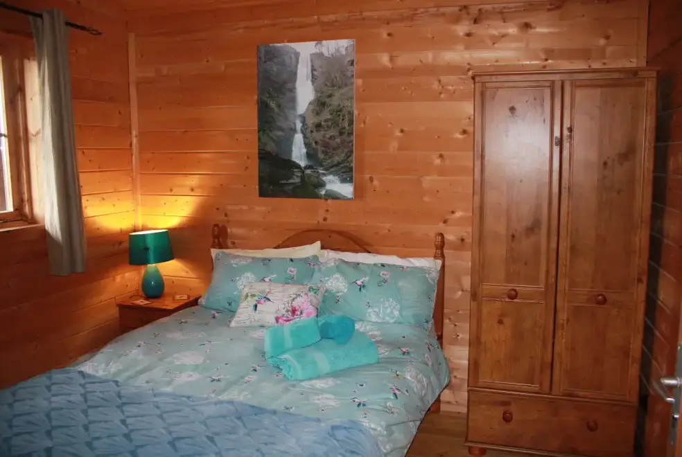 Bedroom at Romantic Cabin Haf with all weather Hot Tub