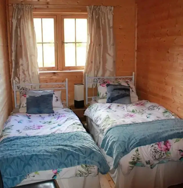 Bedroom at Romantic Cabin Haf with all weather Hot Tub