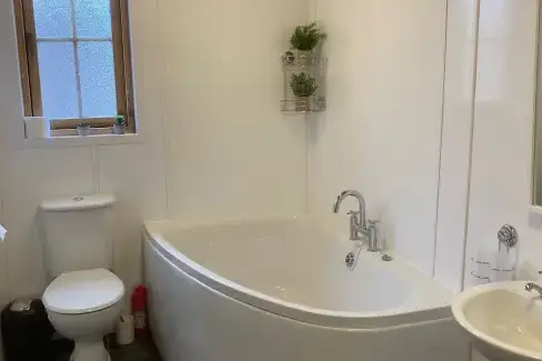 Family bathroom at Romantic Cabin Haf with all weather Hot Tub, Powys