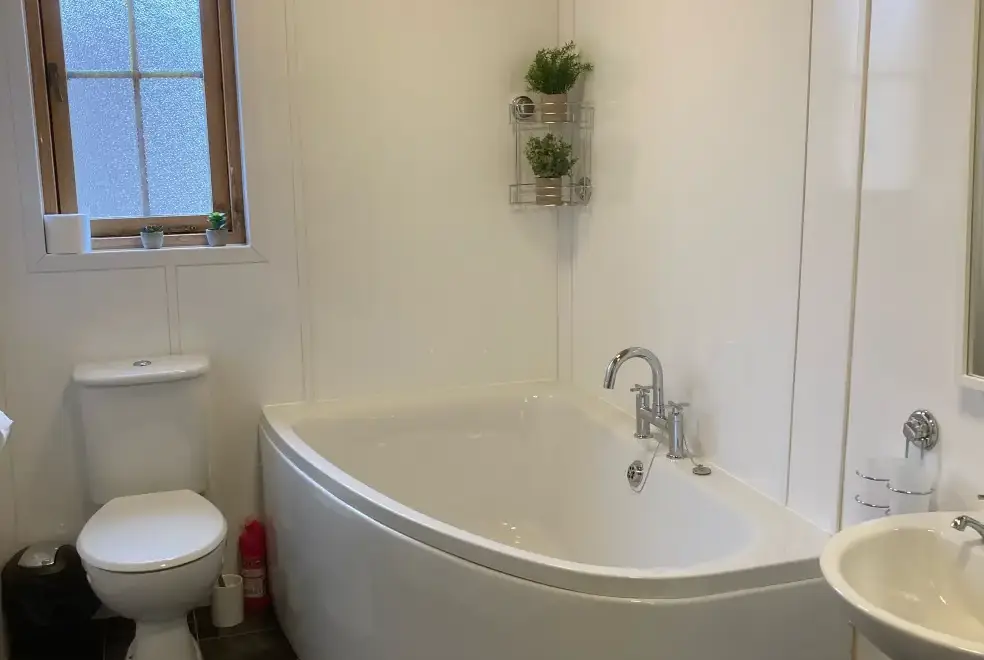 Family bathroom at Romantic Cabin Haf with all weather Hot Tub