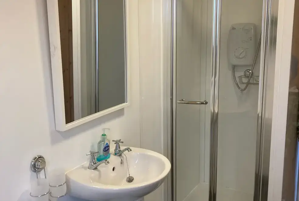 Shower room at Romantic Cabin Haf with all weather Hot Tub