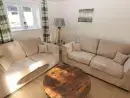 Lounge at Saddlers Cottage, Berllandeg Farm - thumbnail photo