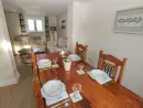 Dining room at Saddlers Cottage, Berllandeg Farm - thumbnail photo