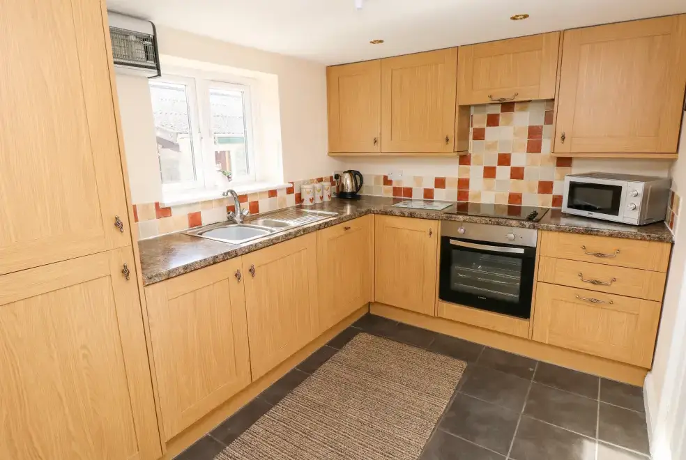 Kitchen/diner at Saddlers Cottage, Berllandeg Farm