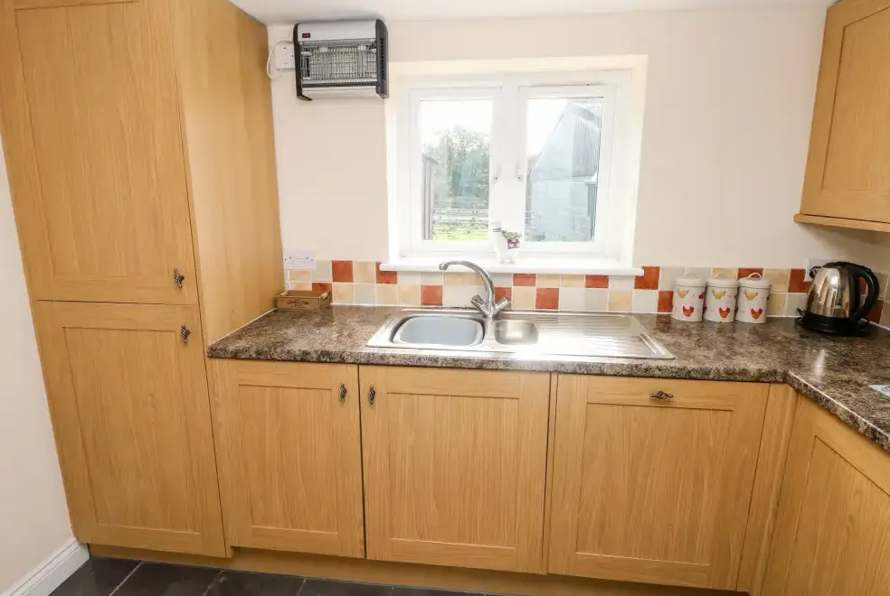 Well equipped kitchen at Saddlers Cottage, Berllandeg Farm