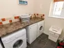Utility room at Saddlers Cottage, Berllandeg Farm - thumbnail photo