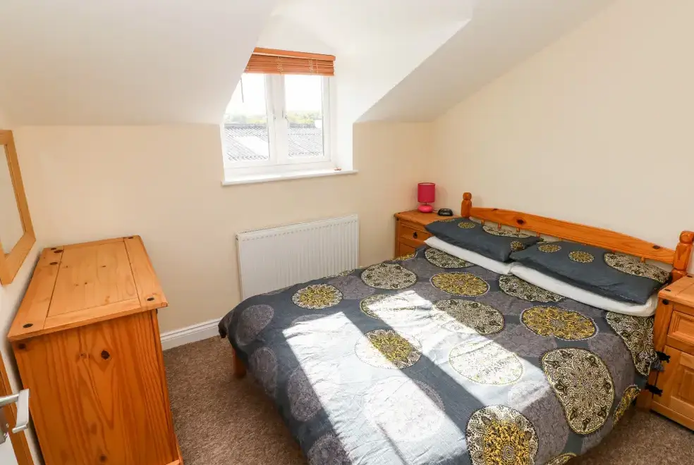 Bedroom at Saddlers Cottage, Berllandeg Farm