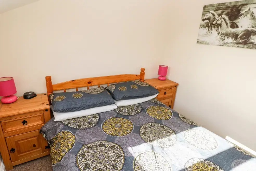 Bedroom at Saddlers Cottage, Berllandeg Farm