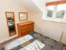Bedroom at Saddlers Cottage, Berllandeg Farm - thumbnail photo