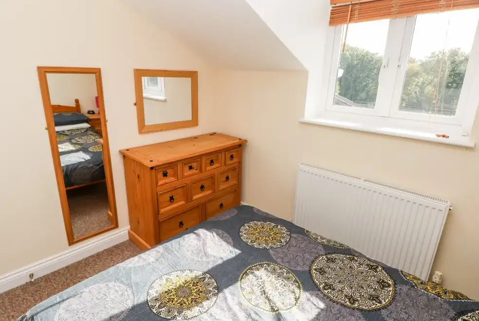 Bedroom at Saddlers Cottage, Berllandeg Farm