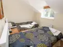 Bedroom at Saddlers Cottage, Berllandeg Farm - thumbnail photo