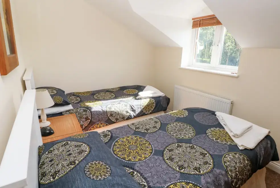 Bedroom at Saddlers Cottage, Berllandeg Farm