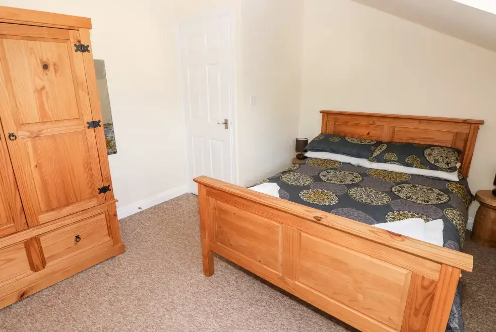 Bedroom at Saddlers Cottage, Berllandeg Farm