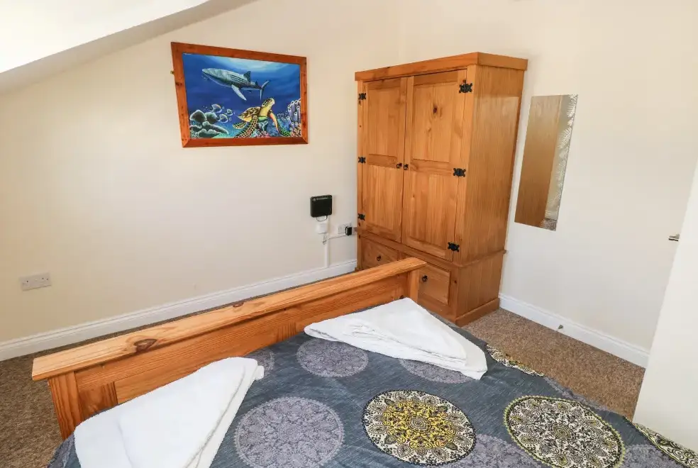 Bedroom at Saddlers Cottage, Berllandeg Farm