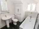 Family bathroom at Saddlers Cottage, Berllandeg Farm - thumbnail photo