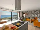 Open plan living area at Sea Sands - thumbnail photo