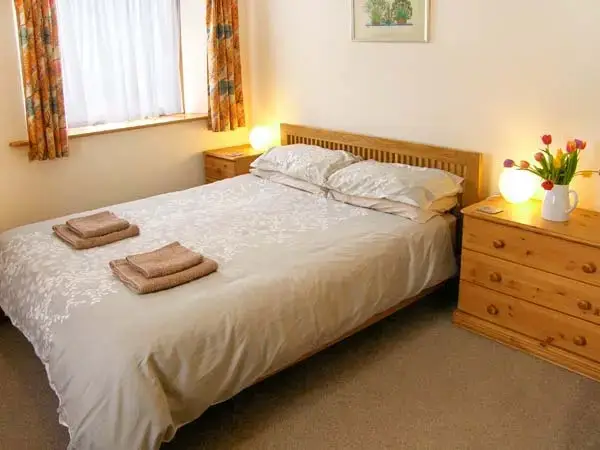 Bedroom at Shepherd's Hut Barn, rural Dorset