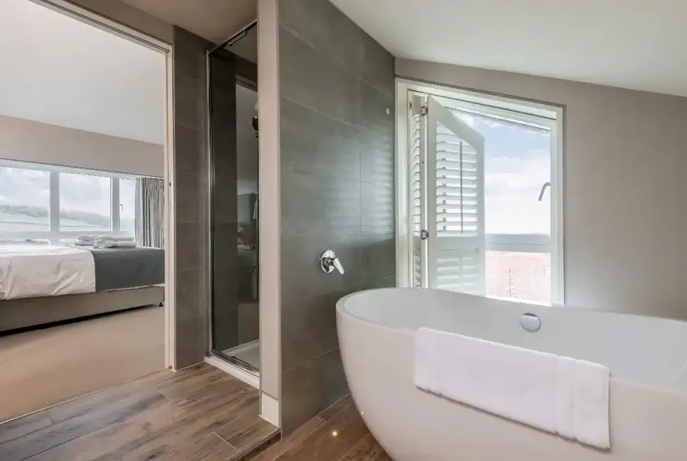 Ensuite bathroom at Sleeps 10, Gold Award Winning House, M1 rated, ideal for all generations with downstairs bedroom and wet room